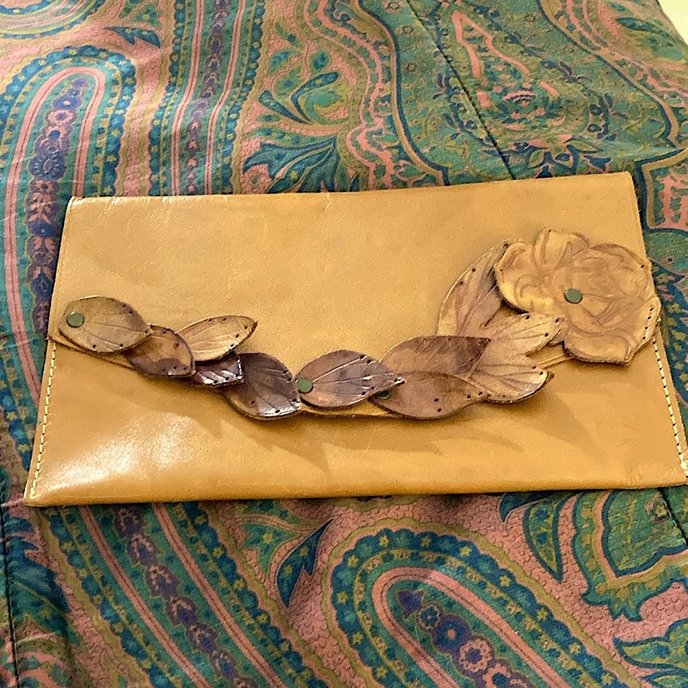 GAP-Tan leather Clutch with leather Leaves and Flower Design.